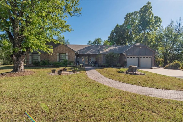 single story home featuring a front lawn and a garage