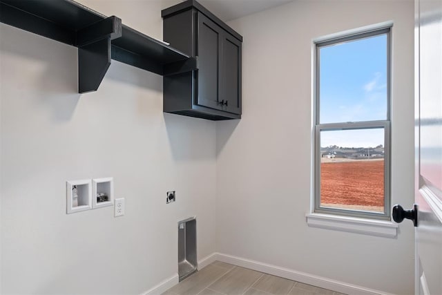 washroom with hookup for an electric dryer, plenty of natural light, cabinets, and hookup for a washing machine