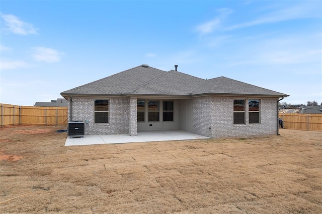 rear view of house featuring a patio area and central air condition unit