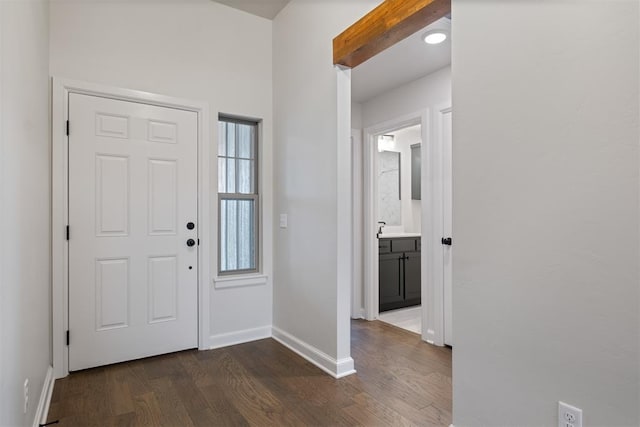 foyer with dark hardwood / wood-style flooring