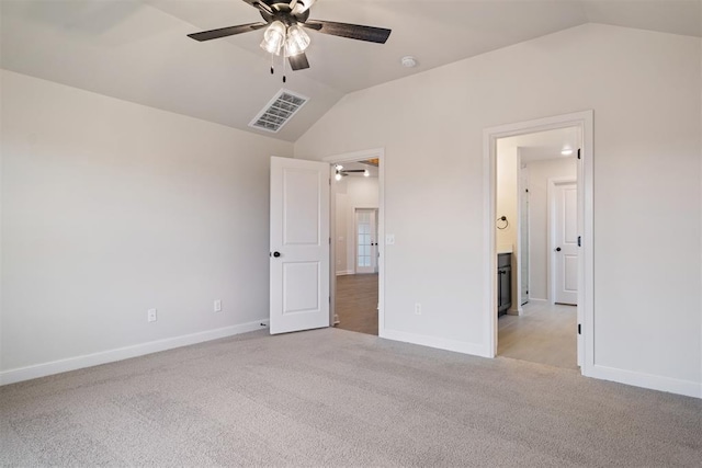 unfurnished bedroom with ceiling fan, light carpet, and lofted ceiling