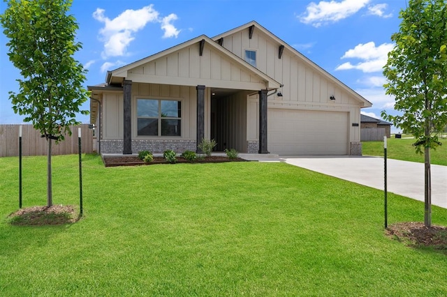 590 Emmy Jean Dr, Blanchard, OK 73010 - view of front of property featuring driveway, an attached garage, board and batten siding, brick siding, and a porch