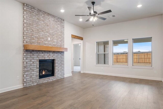 590 Emmy Jean Dr, Blanchard, OK 73010 - unfurnished living room with ceiling fan, dark wood-style flooring, a fireplace, and recessed lighting