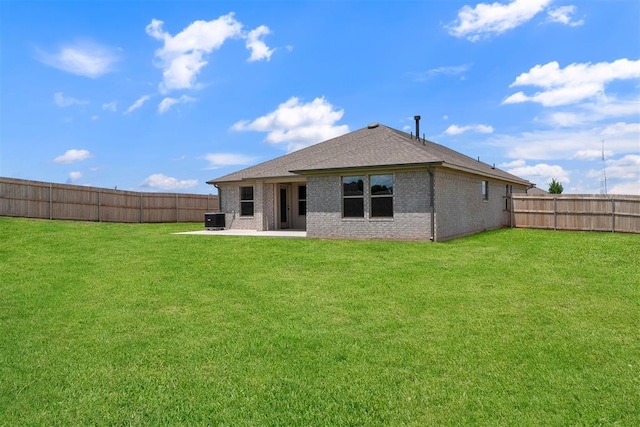 590 Emmy Jean Dr, Blanchard, OK 73010 - rear view of property featuring a fenced backyard, brick siding, a patio, and a shingled roof