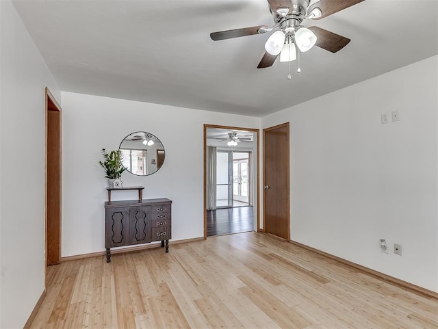 unfurnished room featuring ceiling fan and light hardwood / wood-style floors