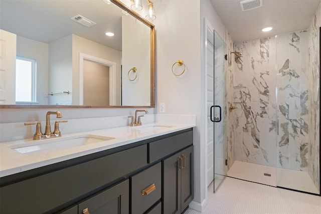 bathroom featuring vanity and a shower with shower door