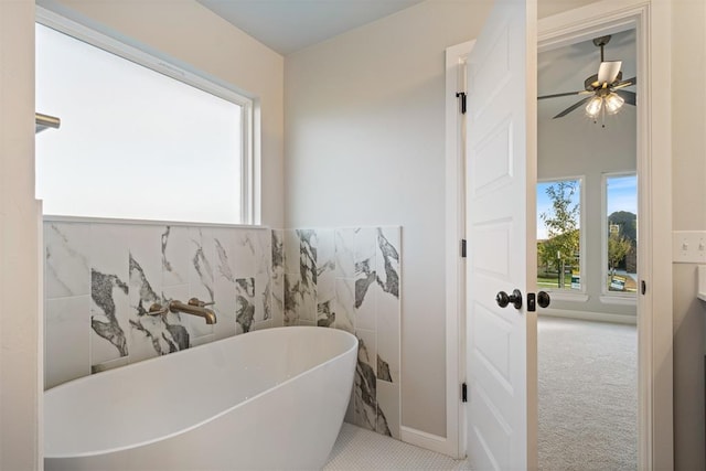 bathroom with a bathtub and ceiling fan