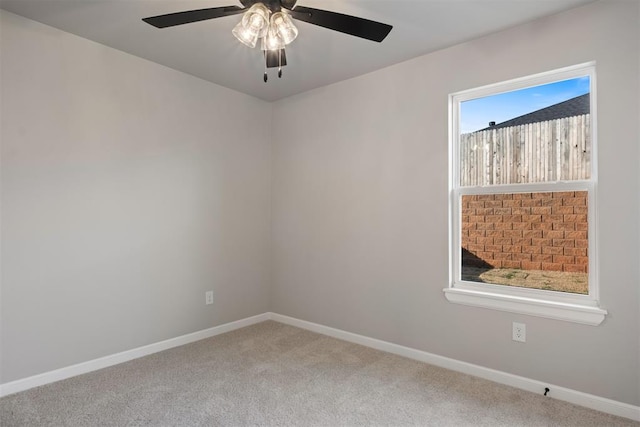 spare room with ceiling fan and carpet floors