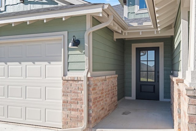 doorway to property featuring a garage