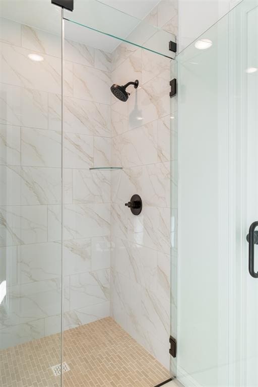 bathroom featuring an enclosed shower