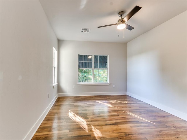 empty room featuring hardwood / wood-style floors and ceiling fan