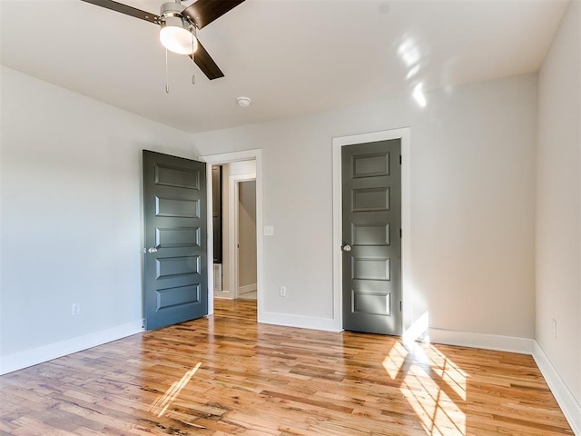 unfurnished room featuring light hardwood / wood-style floors and ceiling fan