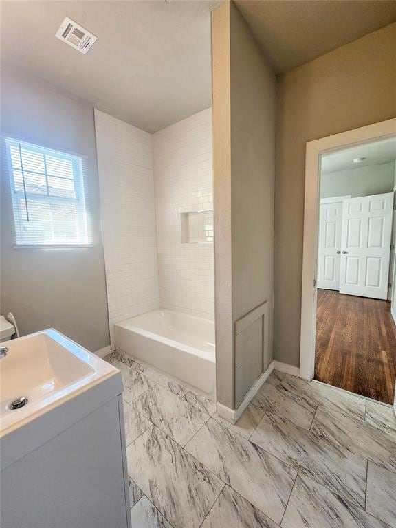 bathroom with wood-type flooring and vanity