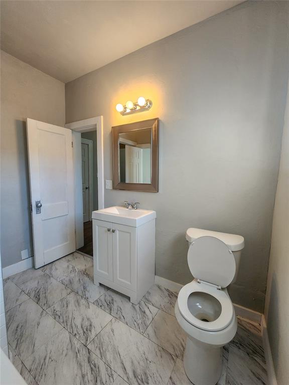 bathroom with vanity and toilet