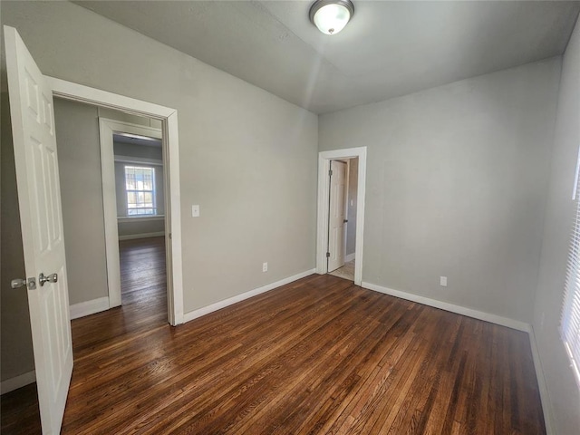 spare room featuring dark hardwood / wood-style flooring