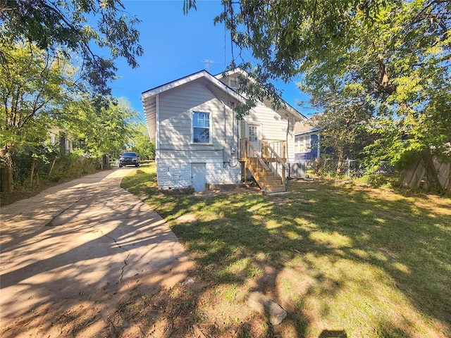 rear view of property featuring a yard