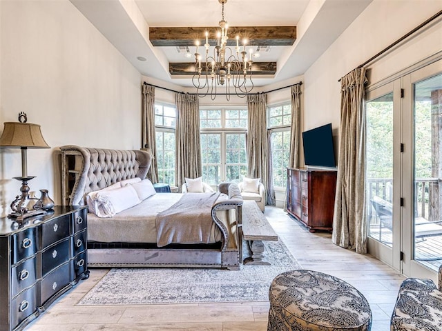 bedroom featuring access to exterior, beam ceiling, an inviting chandelier, and light hardwood / wood-style flooring