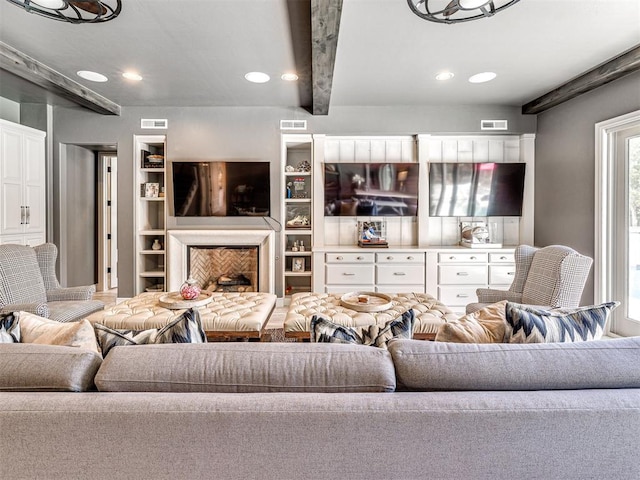 living room featuring beamed ceiling