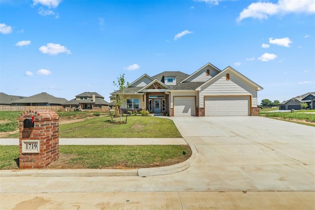 craftsman house with a garage and a front yard