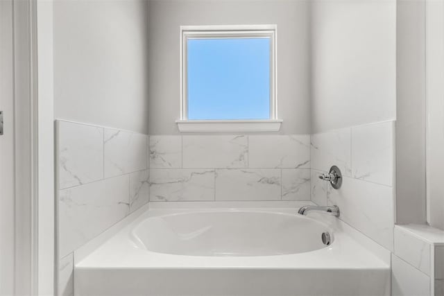 bathroom featuring a bath