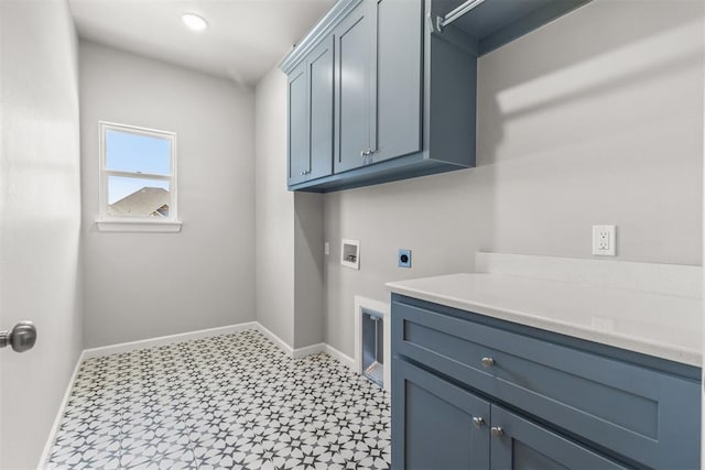 washroom with hookup for an electric dryer, cabinets, and washer hookup