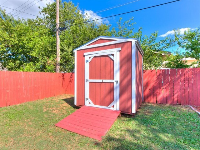 view of outbuilding featuring a lawn