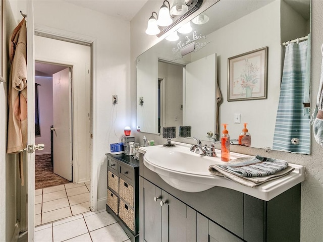 bathroom with tile patterned flooring and vanity