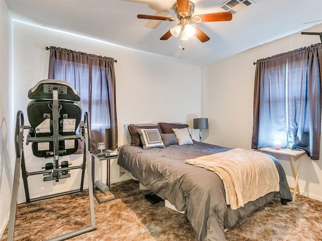 carpeted bedroom featuring ceiling fan