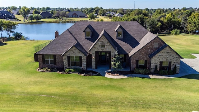 view of front of house with a water view and a front yard