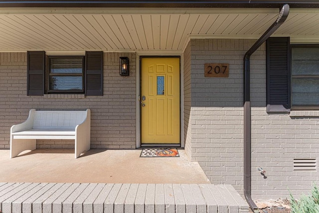 property entrance with covered porch