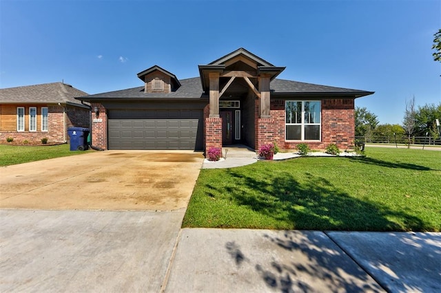 view of front facade with a front lawn and a garage