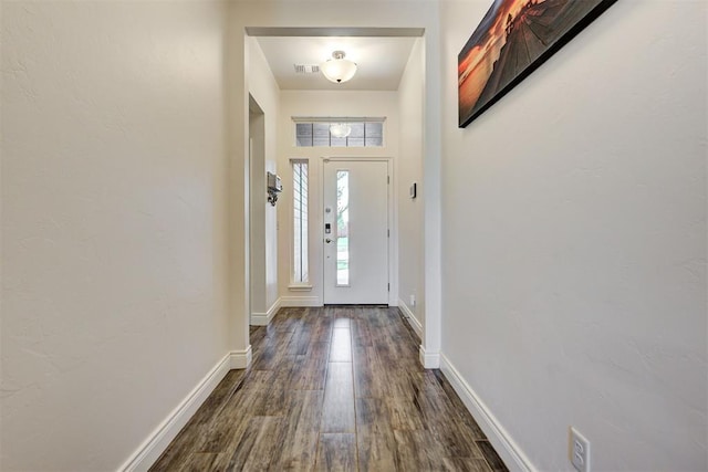 foyer with dark hardwood / wood-style floors