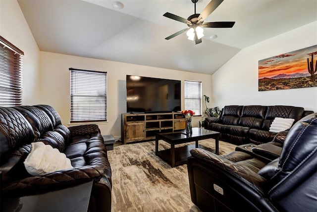 living room featuring ceiling fan, hardwood / wood-style floors, a healthy amount of sunlight, and lofted ceiling