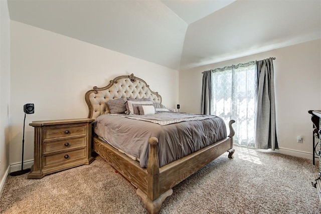 bedroom with light colored carpet and lofted ceiling