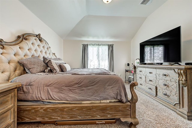 bedroom with carpet floors and vaulted ceiling