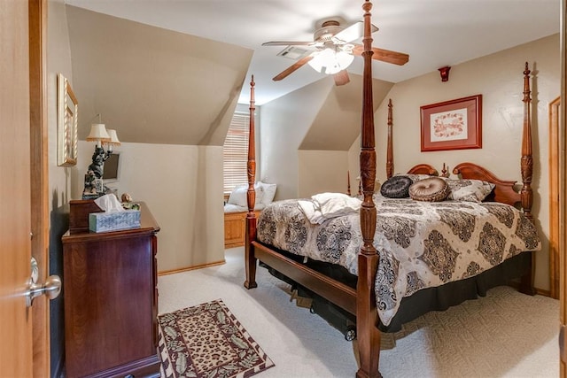 bedroom with ceiling fan, light carpet, and vaulted ceiling