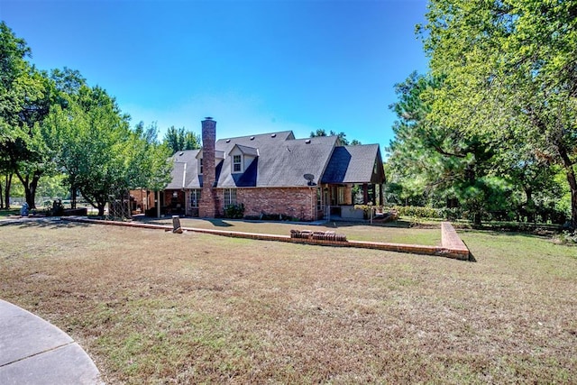 view of side of property with a lawn