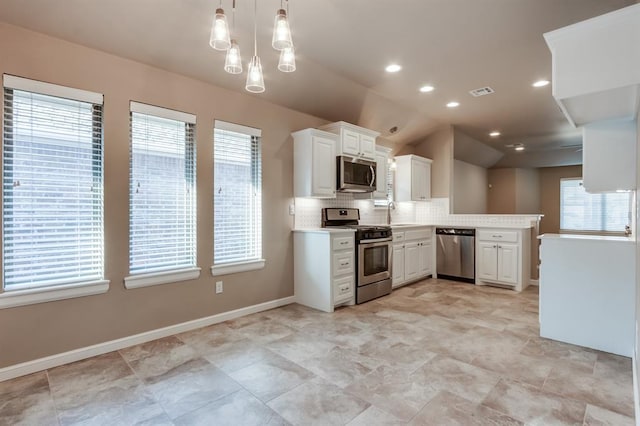 kitchen featuring white cabinets, a healthy amount of sunlight, and stainless steel appliances