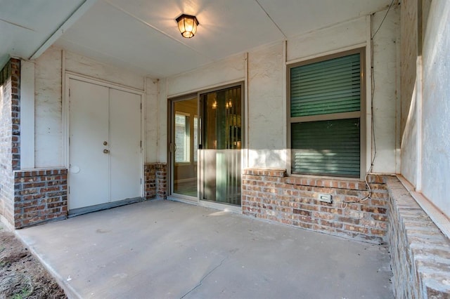 property entrance featuring a patio area