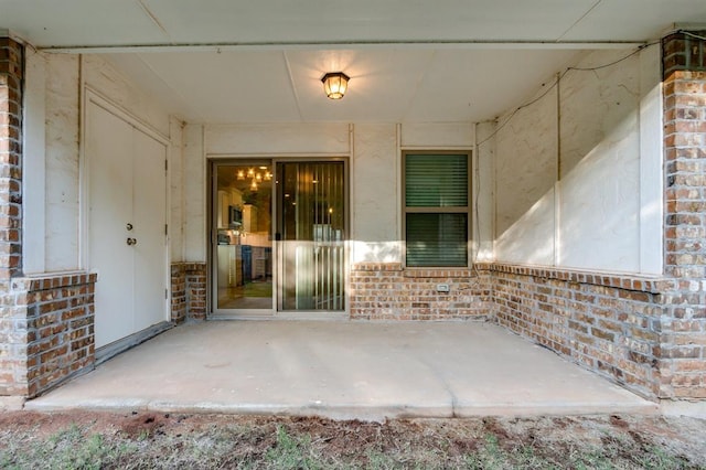 doorway to property with a patio