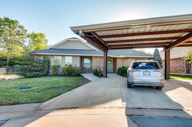 view of front facade with a front lawn and a carport