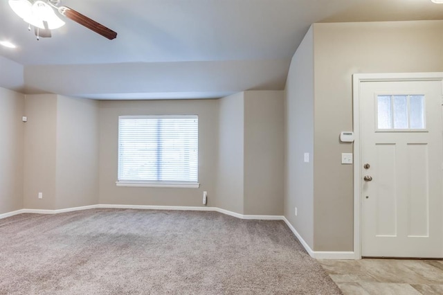 entrance foyer with light carpet and ceiling fan