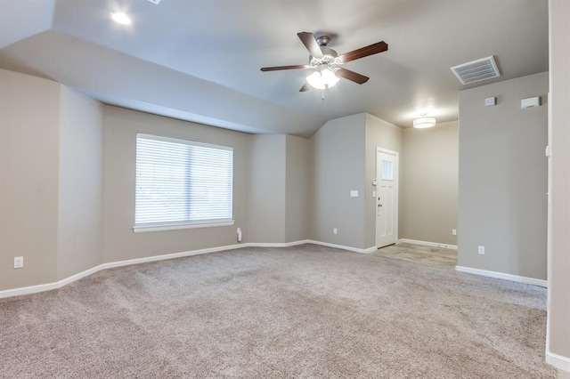 unfurnished room with light carpet, ceiling fan, and lofted ceiling