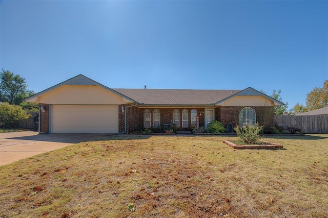 single story home featuring a garage and a front lawn