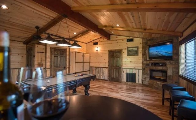 rec room with hardwood / wood-style flooring, lofted ceiling with beams, wooden walls, and billiards