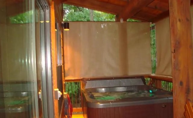 bathroom featuring beamed ceiling