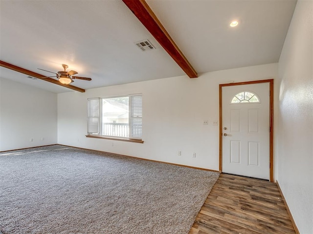 entrance foyer with ceiling fan, lofted ceiling with beams, and dark hardwood / wood-style floors