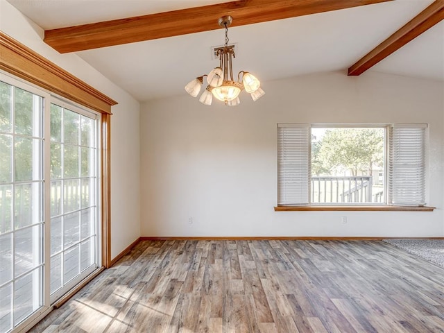 unfurnished room featuring light wood-type flooring, a healthy amount of sunlight, lofted ceiling with beams, and a notable chandelier