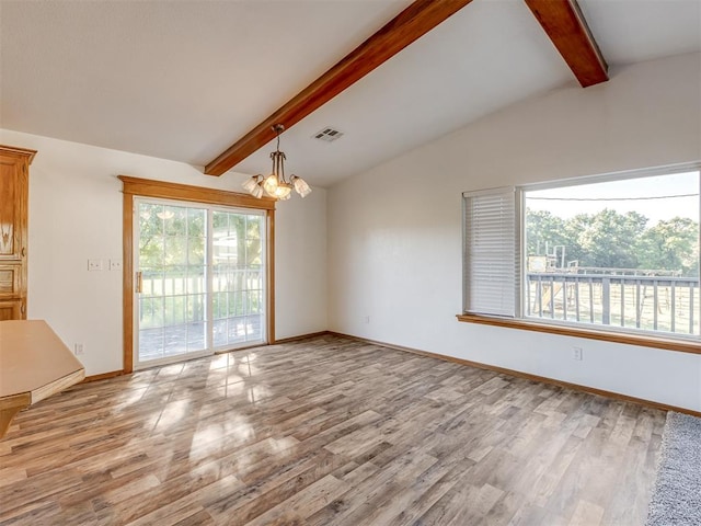 empty room with vaulted ceiling with beams, a wealth of natural light, light hardwood / wood-style flooring, and a notable chandelier