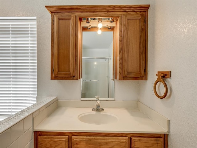 bathroom with vanity and an enclosed shower